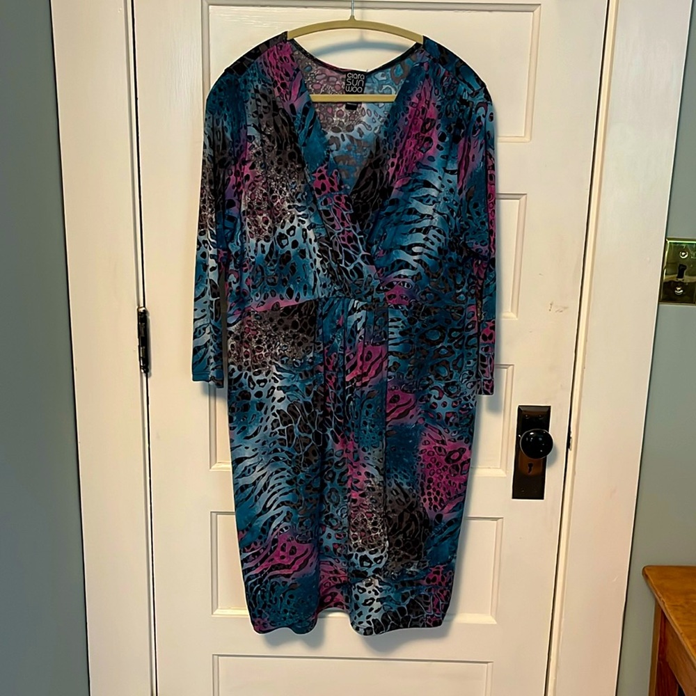 Ladies dress with stretch waist. Pleat that opens on skirt .